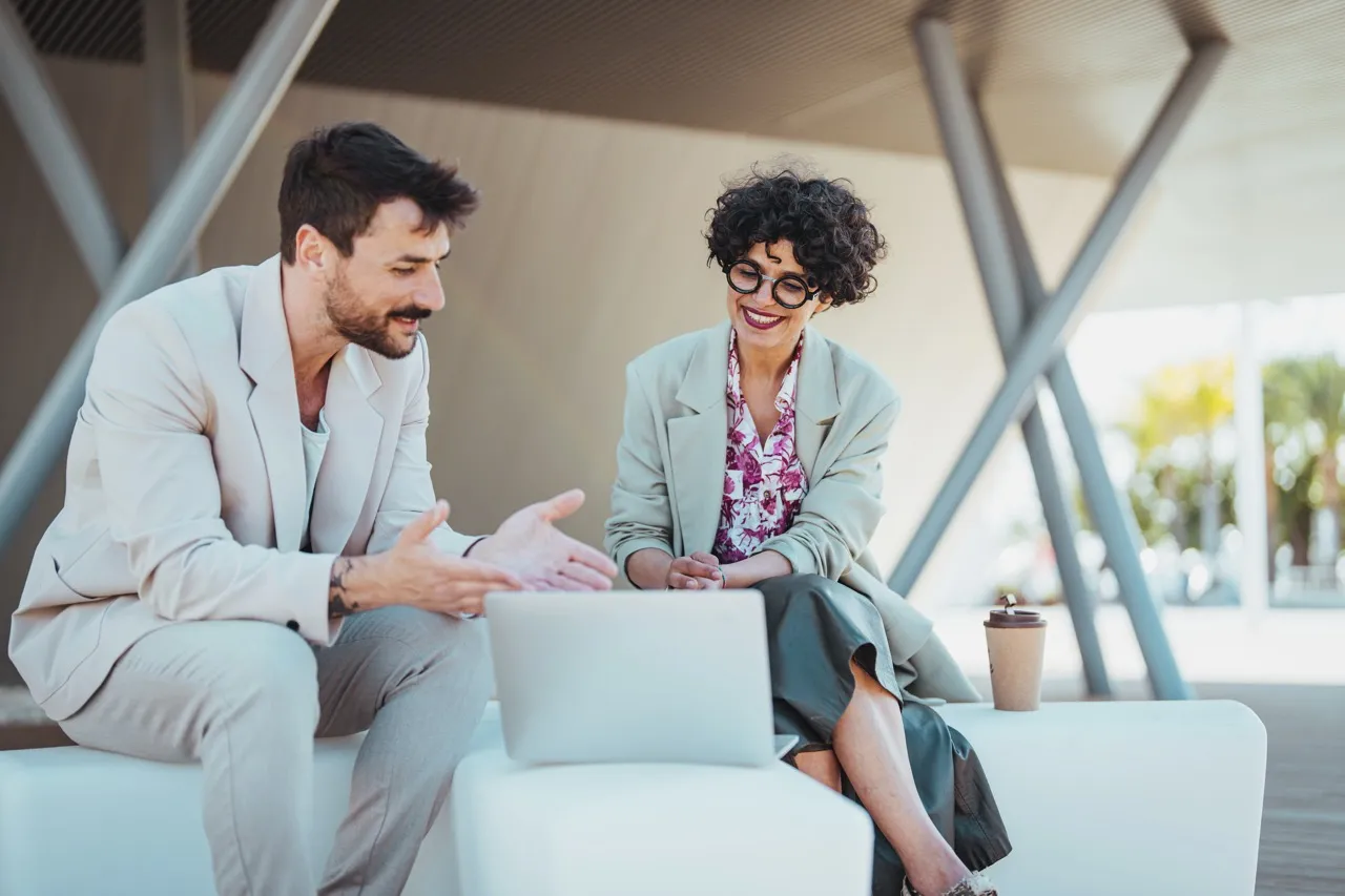 A man and a woman have a meeting at work