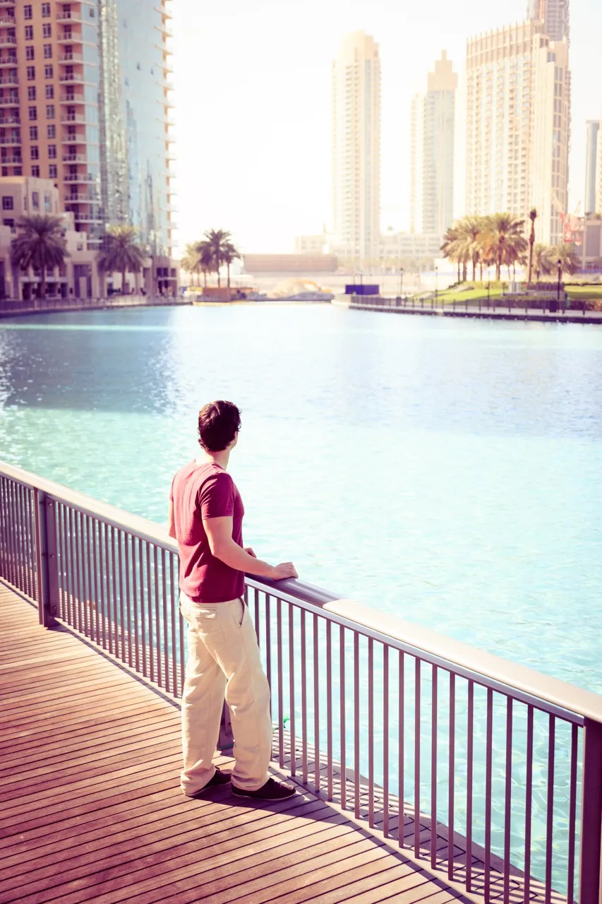 Man is looking from the bridge