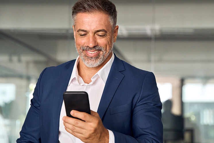 Man reads on mobile phone