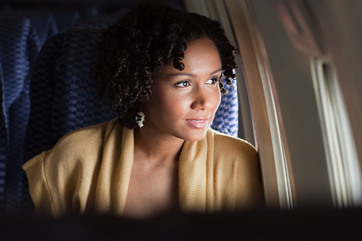 Woman looks by the window