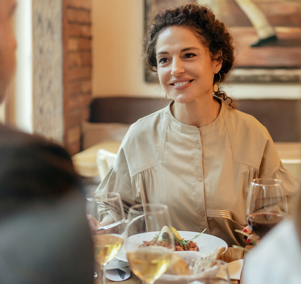 Woman eats dinner in the restaurant
