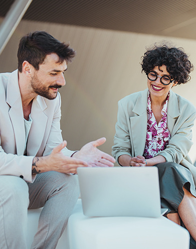 Man and woman talk at work