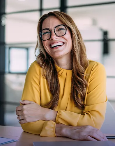Woman is siting and smiling