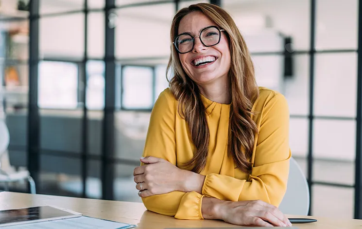 Woman is siting and smiling