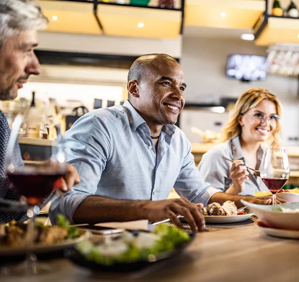 Man eats dinner with friends