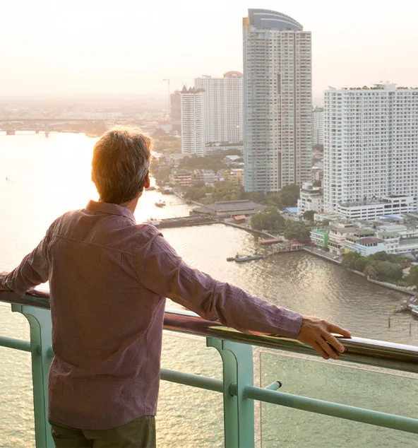 Man is looking from the bridge