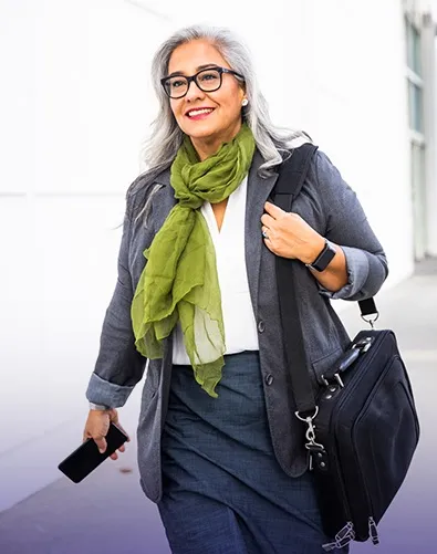 Woman walks with a bag and mobile phone