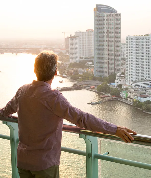 Man is looking away from the bridge