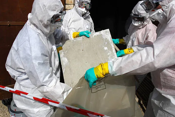 Workers remove asbestos