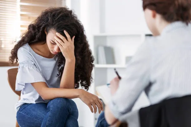 Resigned woman in therapy with doctor