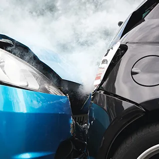 A photo of a collision of two cars