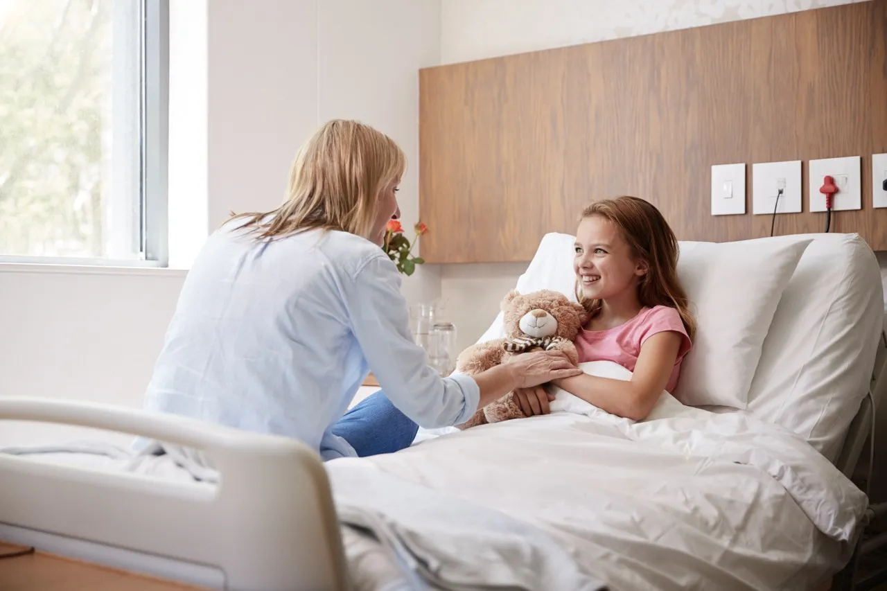 A little girl lying in hospital