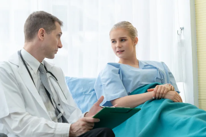Doctor and lying patient