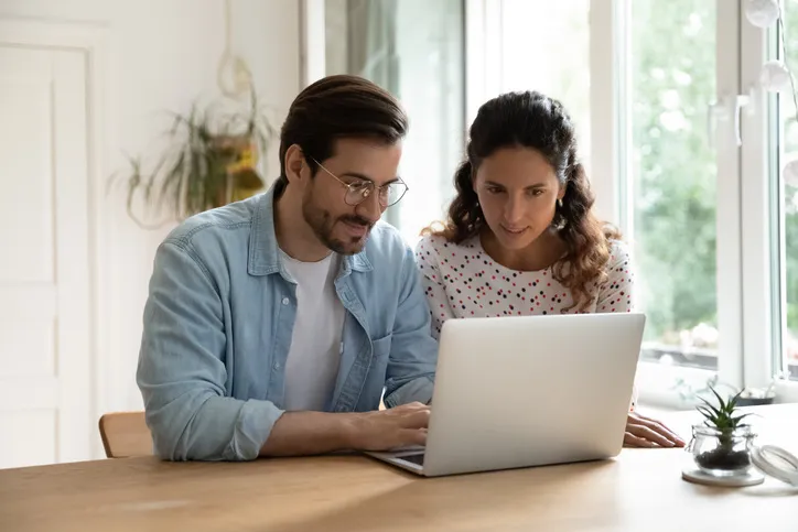 Couple work on the computer