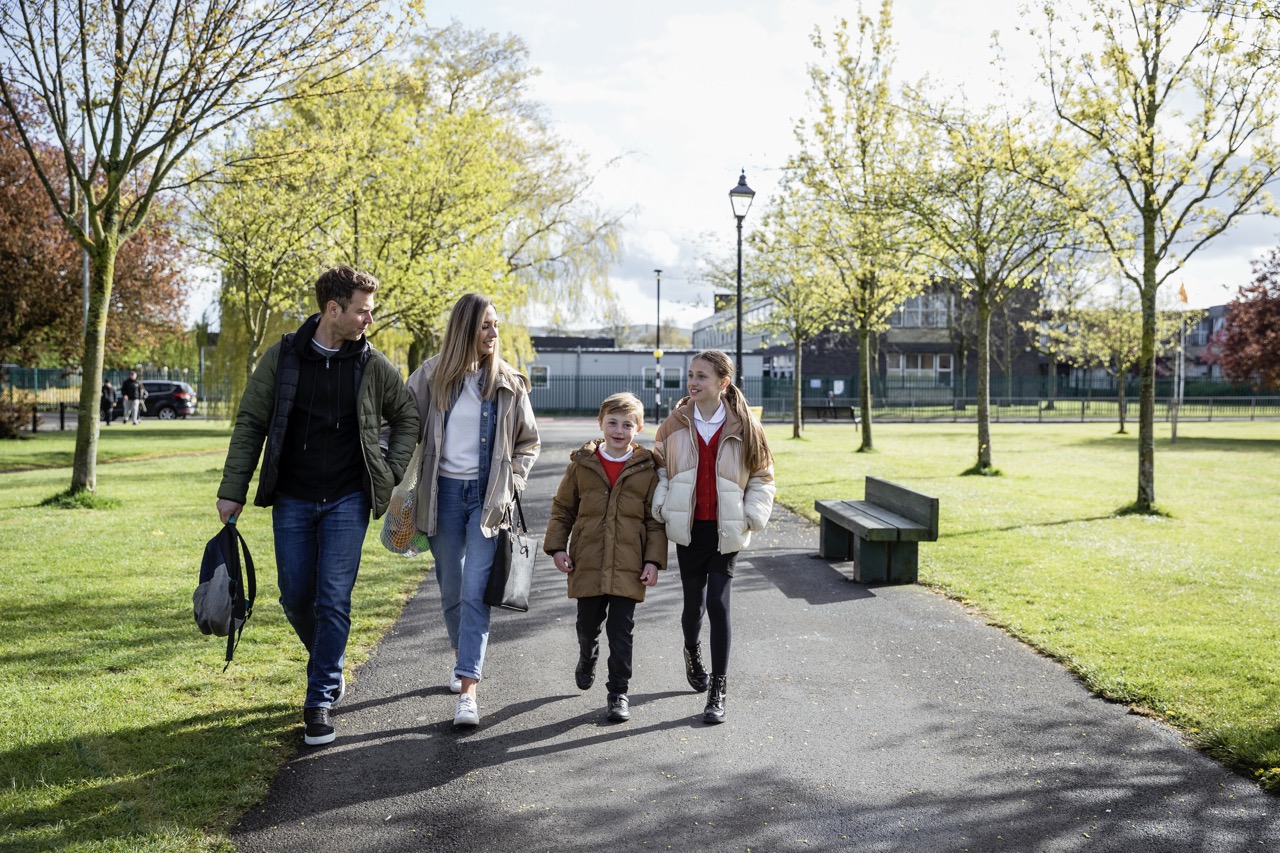Happy family walking in the park