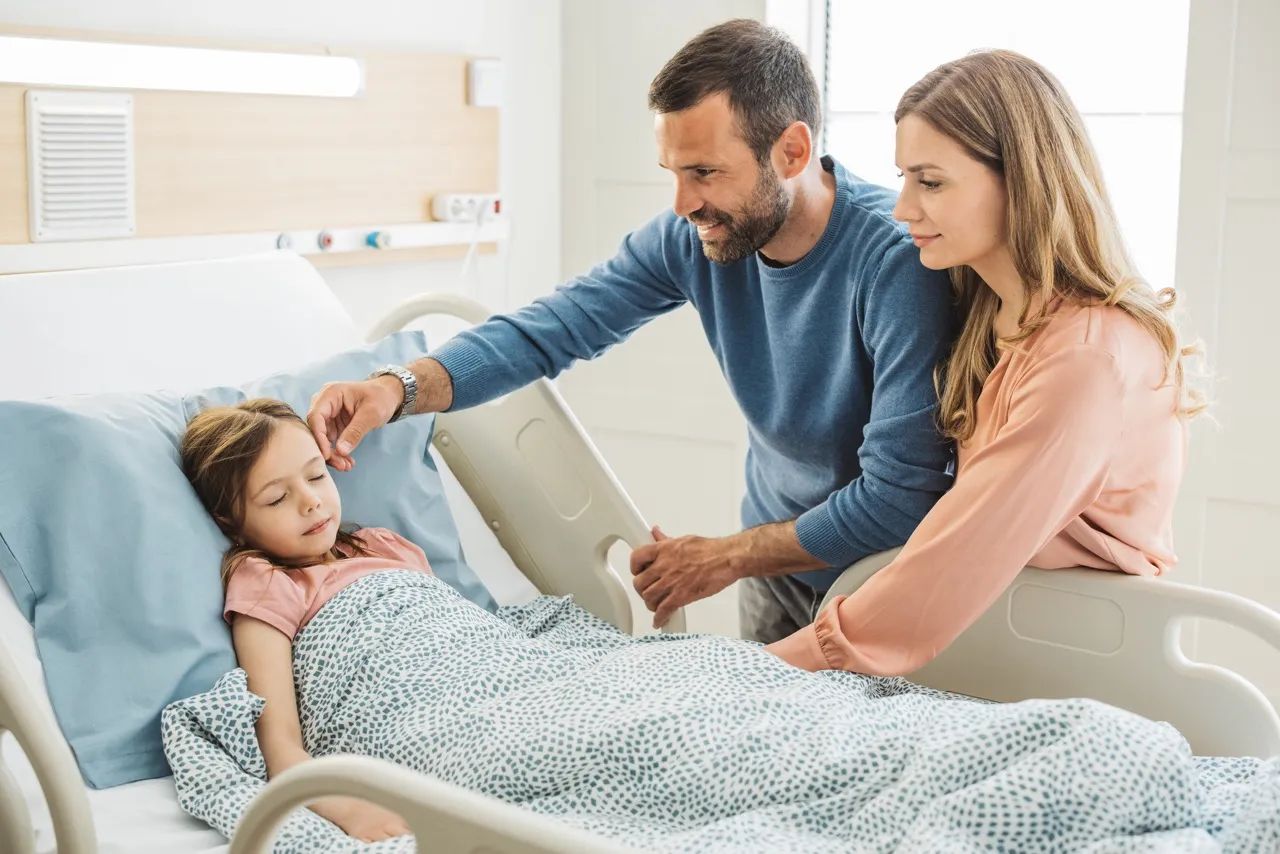 Parents visit their daughter in the hospital