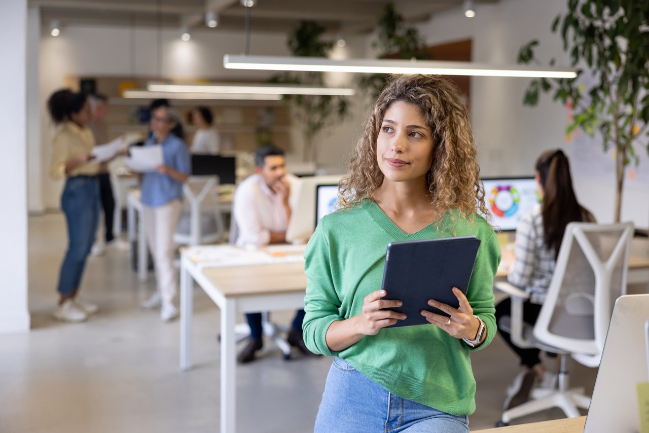A girl holding a tablet and planning her work in