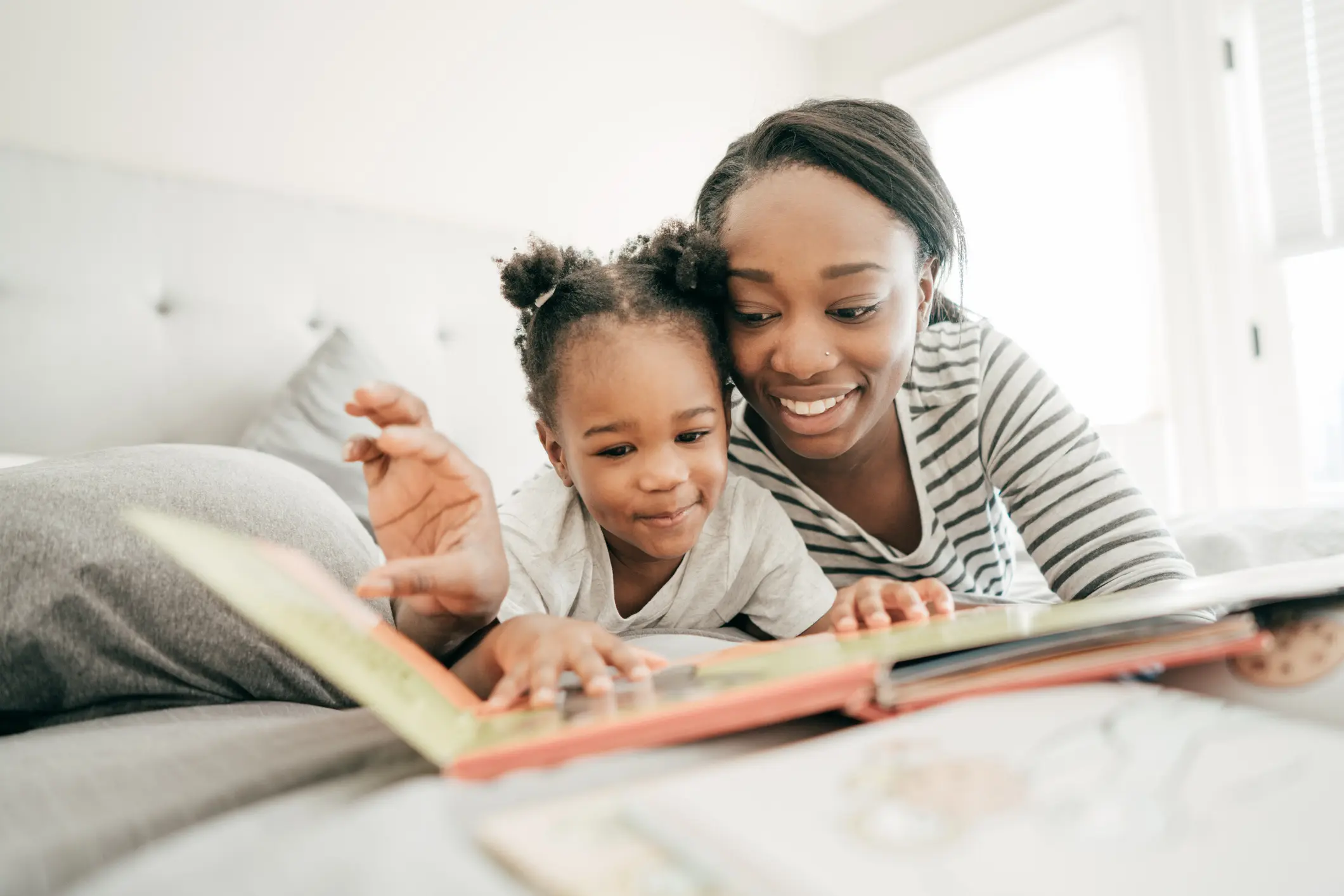 Mother and daughter reading a book